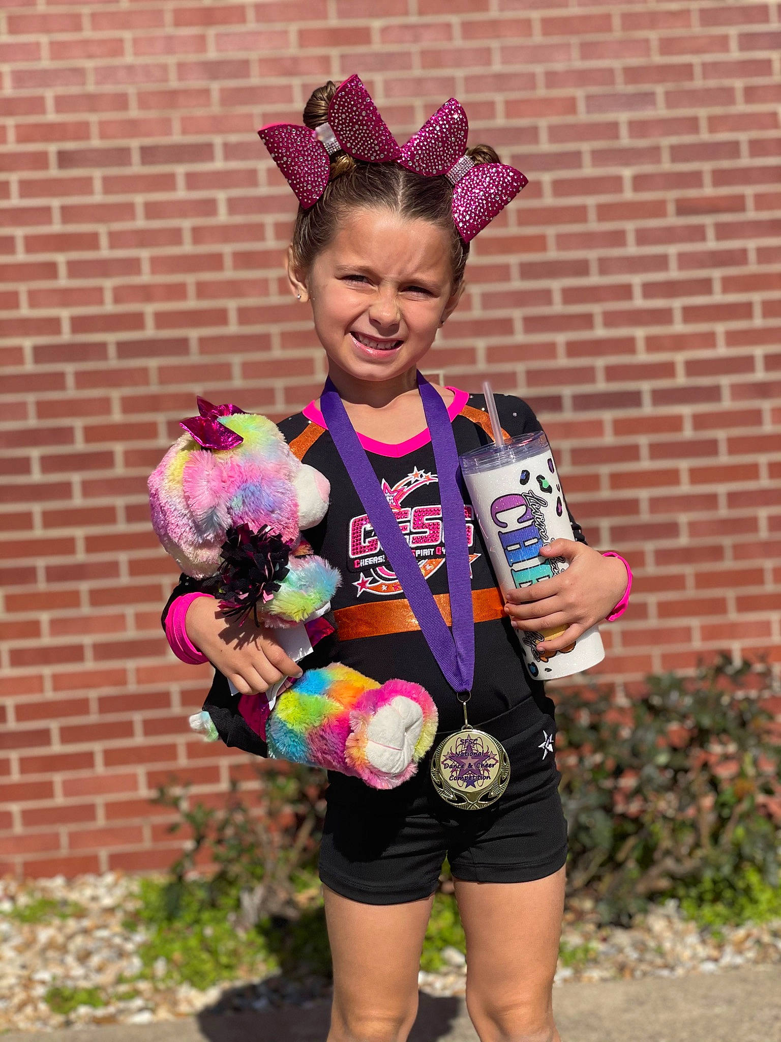 Ophelia joined the competition — help win amazing prizes! brick, brickwork, costume, event, fashion_accessory, feather, fun, grass, happy, headpiece, jewellery, joy, magenta, necklace, party_supply, person, photograph, pink, plant, shorts