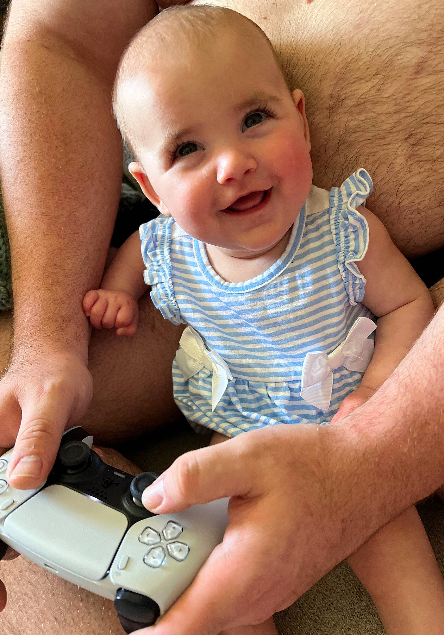 Rosalie is registered to the contest to win money with this photo: arm, baby, baby_toddler_clothing, cheek, communication_device, face, finger, gesture, hand, happy, human, joint, joy, mobile_phone, nail, people, person, product, skin, smile