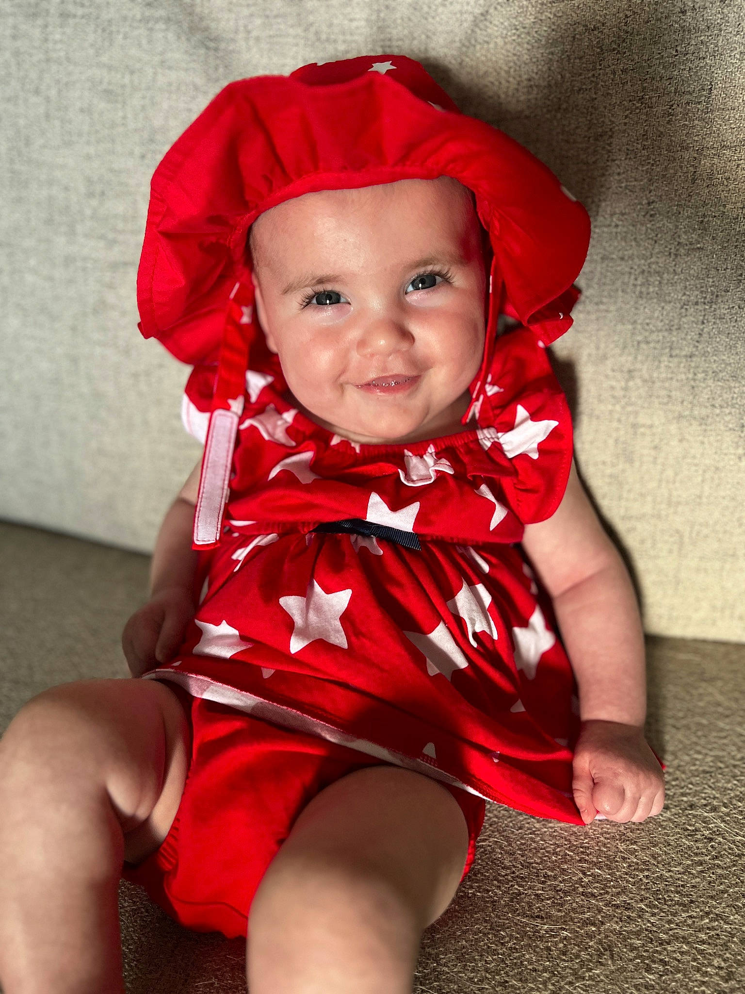 Rosalie is registered to the contest to win money with this photo: baby, baby_toddler_clothing, costume_hat, dress, eye, face, flash_photography, happy, hat, headwear, human_body, joy, lip, magenta, neck, person, pink, red, skin, sleeve