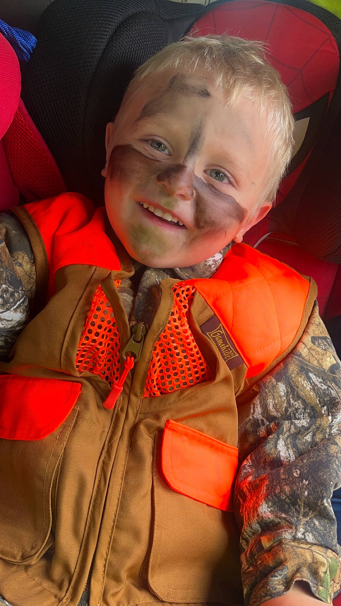 Jaydyn is registered to the contest to win money with this photo: child, event, eye, fashion_accessory, fun, happy, joy, laugh, lifejacket, orange, person, personal_protective_equipment, red, smile, toddler, tradition, uniform, vacation