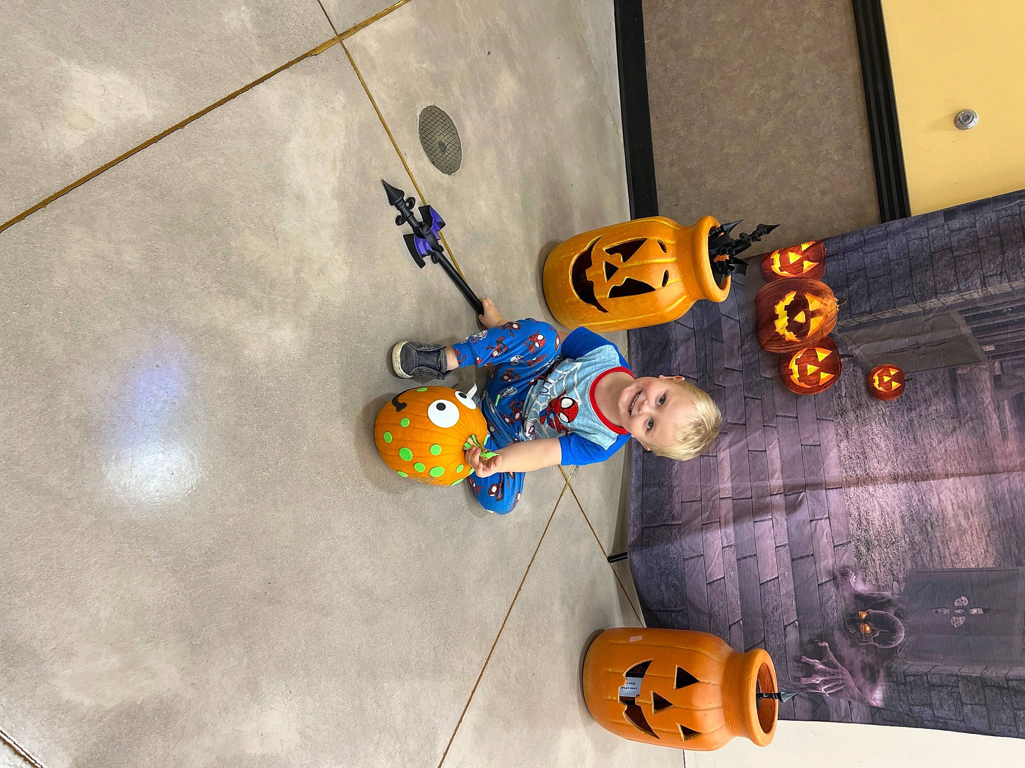 Jaydyn is registered to the contest to win money with this photo: adventure, baby_products, baby_toys, calabaza, child, concrete, electric_blue, fashion_accessory, fictional_character, flooring, fun, joy, orange, person, plush, pumpkin, recreation, room, space, stuffed_toy