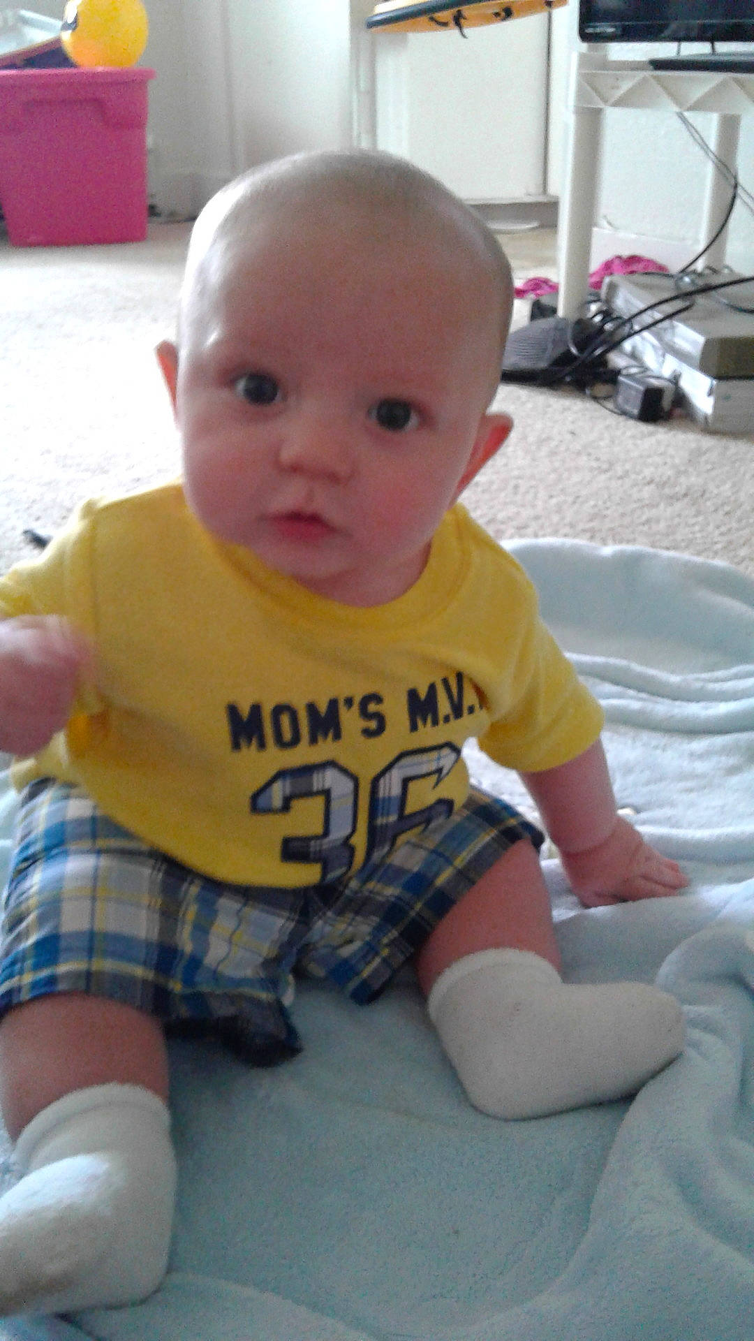 Kevin is registered to the contest to win money with this photo: baby_products, boy, cheek, child, crawling, day, fun, hair, head, human_hair_color, infant, iris, leg, play, product, sitting, skin, smile, toddler, yellow