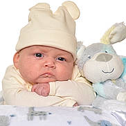 Tyler is registered to the contest to win money with this photo: baby, beanie, bed, blanket, bodypart, bonnet, cap, clothing, face, finger, furniture, hand, hat, head, newborn, person, photography, portrait, sleeping, toy