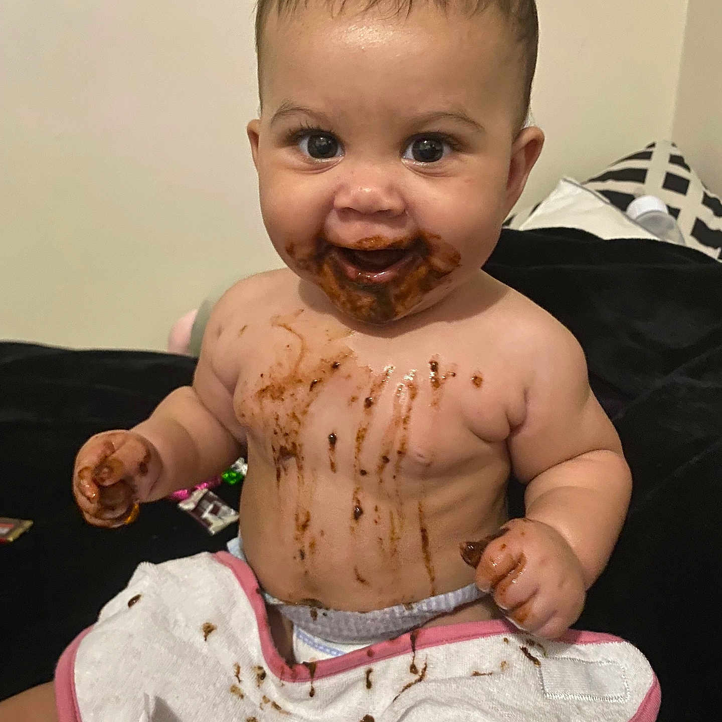 Kenleanna joined the competition — help win amazing prizes! baby, bib, child, chocolate, cute, diaper, expression, face, food, hands, happy, indoor, infant, mess, messy, playful, sitting, skin, small, smiling