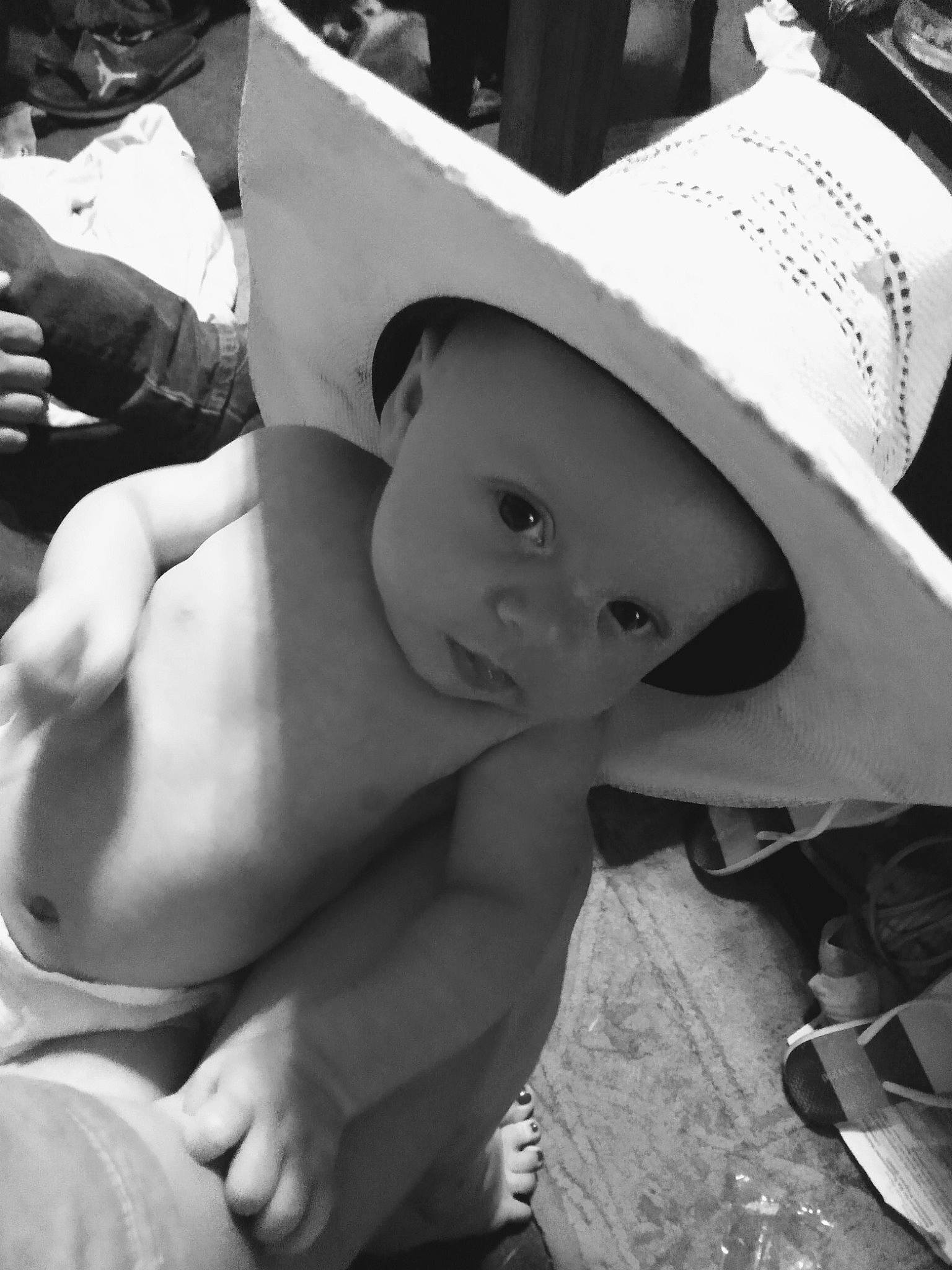 Waylon is registered to the contest to win money with this photo: baby, baby_products, black, black_and_white, cap, child, elbow, fashion_accessory, fun, happy, hat, headwear, monochrome, monochrome_photography, person, sitting, smile, stock_photography, style, sun_hat