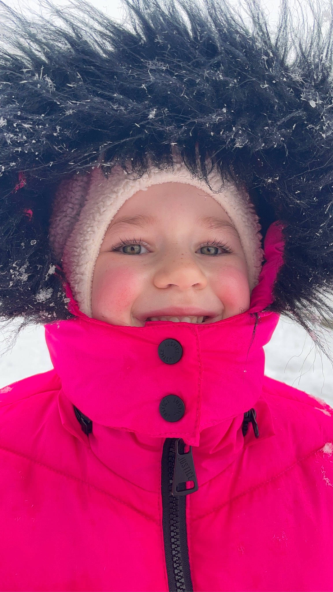 Isabella is registered to the contest to win money with this photo: cheek, cool, eyelash, fun, glove, happy, headwear, jacket, lip, magenta, nose, organ, outerwear, person, pink, skin, sleeve, smile, snow, textile