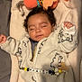 Marley participe au concours pour gagner de l'argent avec cette photo : baby, sleeping, onesie, bear_pattern, blanket, plush_toy, pacifier_clip, cozy, infant, cute, child, soft, resting, indoors, peaceful, curly_hair, white, yellow, black, personalized