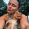 woman, puppy, dog, selfie, outdoor, trees, sky, tattoo, sunglasses, striped_clothing, happy, smiling, cute, pet, nature, summer, portrait, playful, closeup, expression