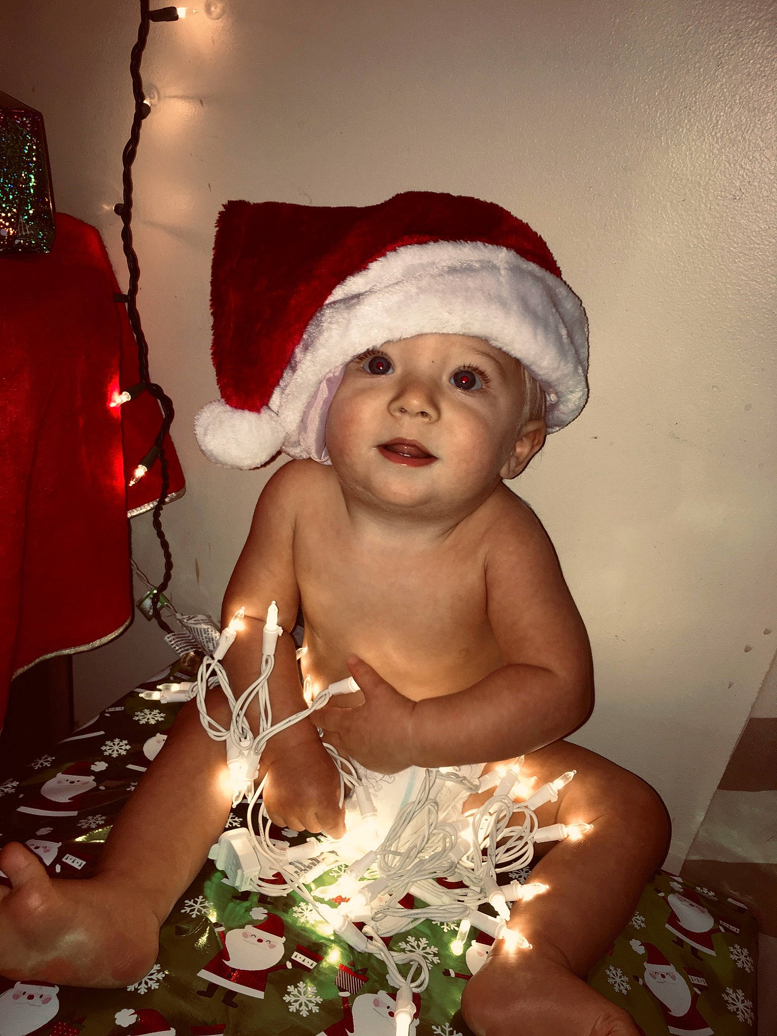 Jaxon is registered to the contest to win money with this photo: child, christmas, christmas_eve, christmas_ornament, fictional_character, headwear, holiday, person, santa_claus