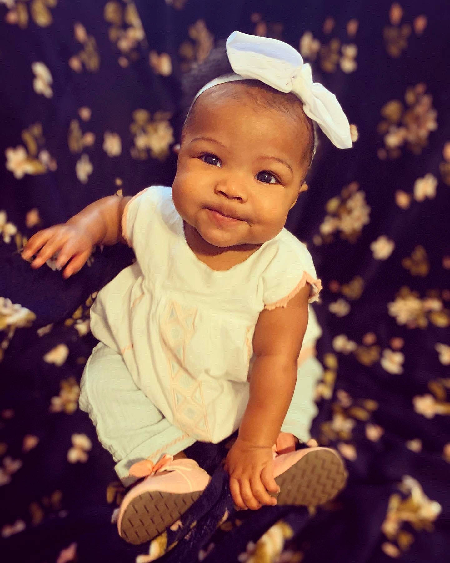 Evynn is registered to the contest to win money with this photo: baby, baby_laughing, cheek, child, cool, facial_expression, fun, hand, happy, head, headgear, human, people, person, photograph, photography, product, sitting, skin, smile