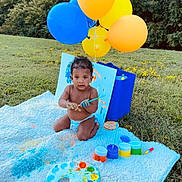 Jonathan is registered to the contest to win money with this photo: toddler, child, painting, paintbrush, balloons, blanket, outdoor, grass, colorful, art, baby, diaper, blue, yellow, orange, green, play, messy, creative, nature