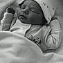 baby, newborn, sleeping, blanket, hat, clothing, infant, face, peaceful, monochrome, black_and_white, texture, cute, soft, portrait, resting, child, cozy, toddler, expression