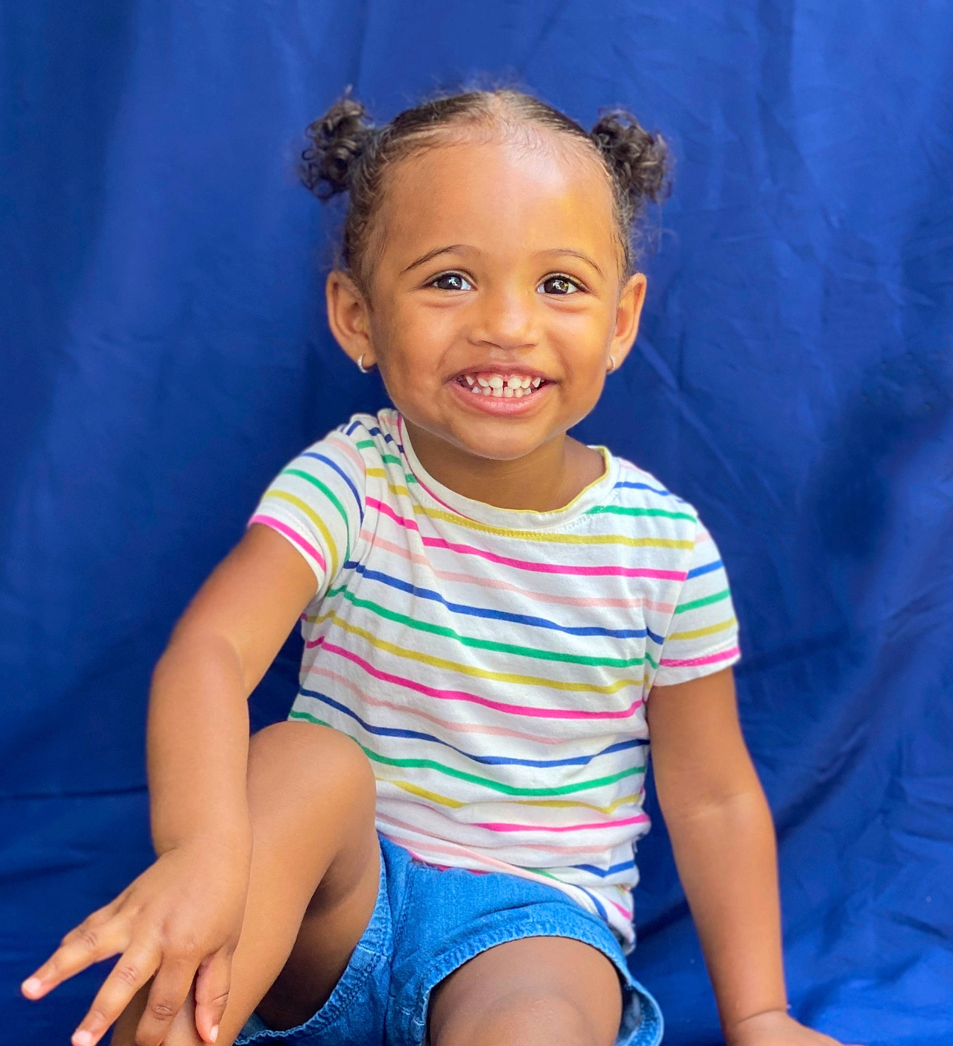 Aubrey is registered to the contest to win money with this photo: baby_toddler_clothing, blue, cheek, child, electric_blue, finger, flash_photography, fun, happy, human_body, human_leg, iris, joy, neck, nose, person, skin, sleeve, smile, t_shirt