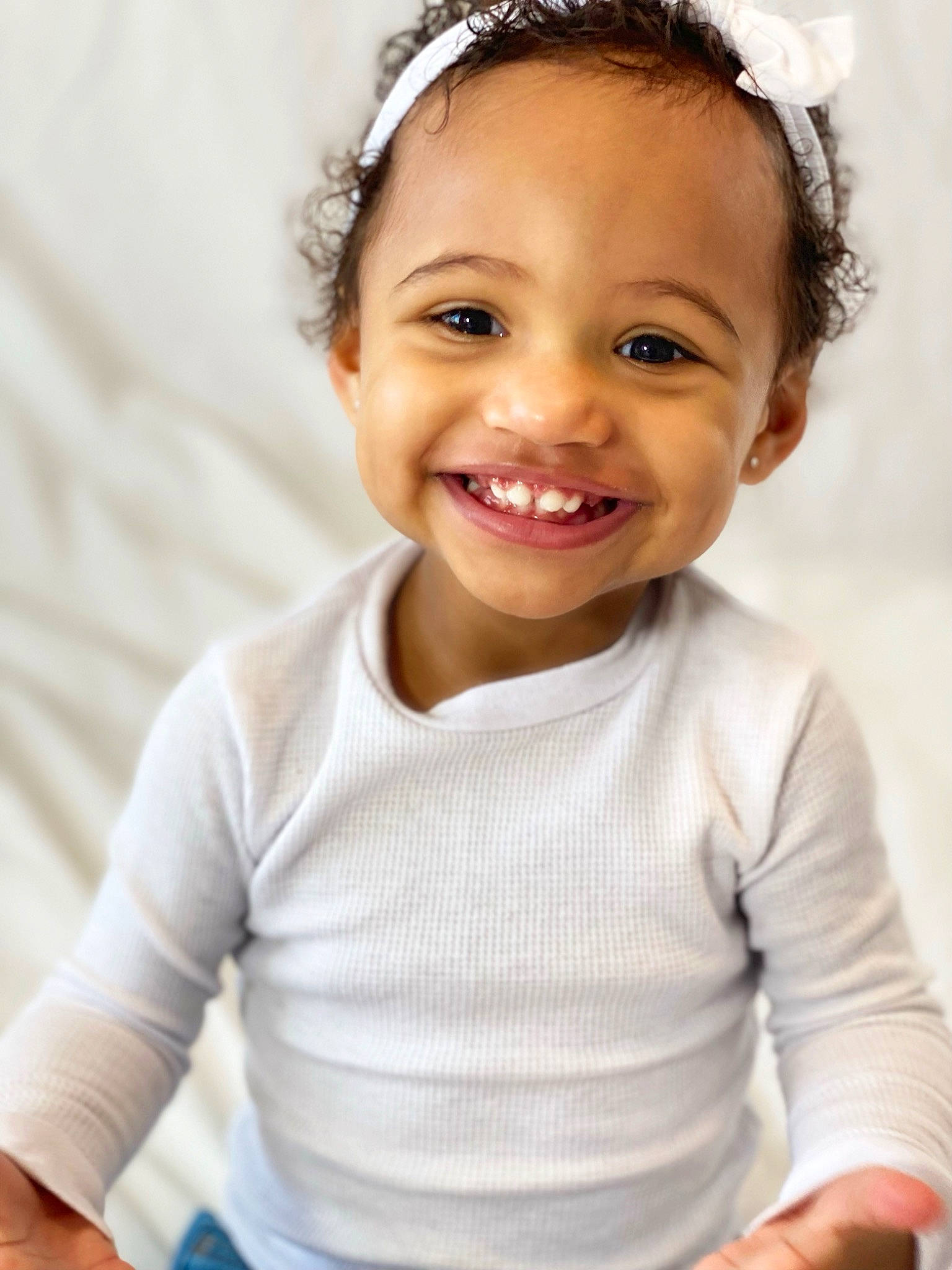 Aubrey is registered to the contest to win money with this photo: baby_toddler_clothing, cheek, chin, eye, eyebrow, face, flash_photography, gesture, hair, hairstyle, happy, head, headgear, iris, joy, lip, person, skin, sleeve, smile