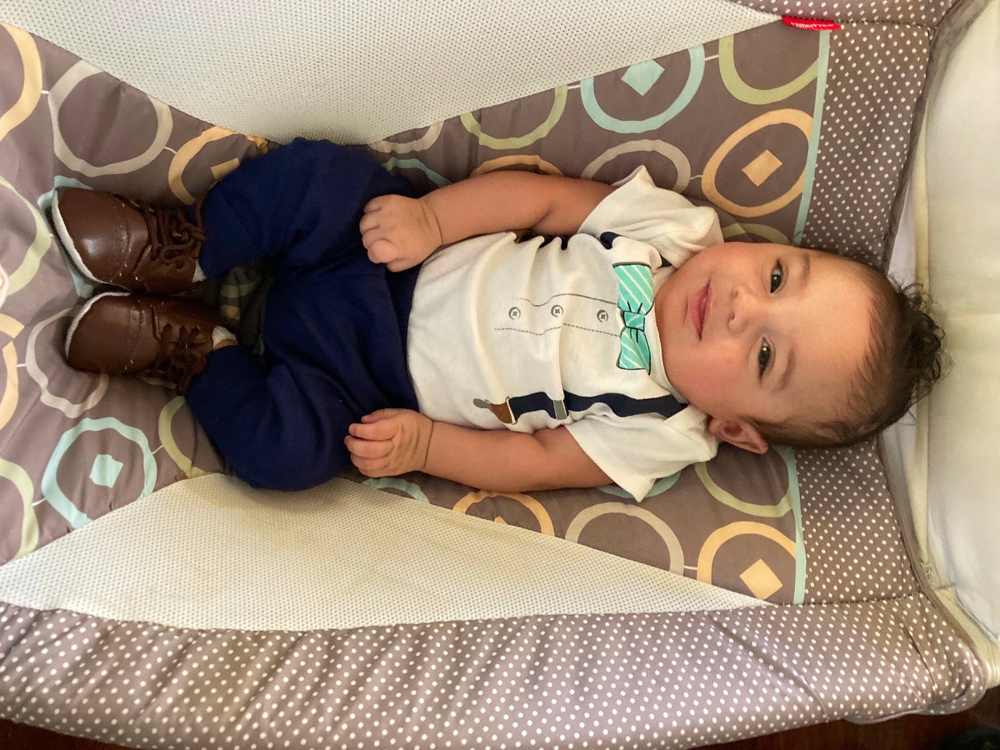 Benson is registered to the contest to win money with this photo: baby, baby_products, baby_toddler_clothing, child, comfort, flooring, fun, hat, linens, pattern, person, product, room, sitting, sleeve, sock, t_shirt, thigh, toddler, vacation
