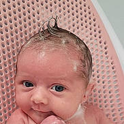 Maya is registered to the contest to win money with this photo: baby, bathing, bathroom, bathtub, bodypart, chair, face, finger, furniture, hand, happy, head, indoors, newborn, person, photography, portrait, room, smile, tub