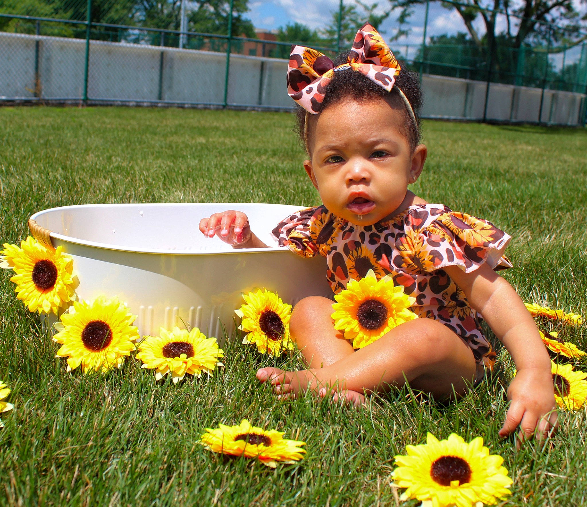 Xiamara is registered to the contest to win money with this photo: botany, facial_expression, flower, fun, grass, green, happy, jeans, leaf, nature, orange, organ, people_in_nature, person, petal, photograph, plant, tree, vertebrate, wheel