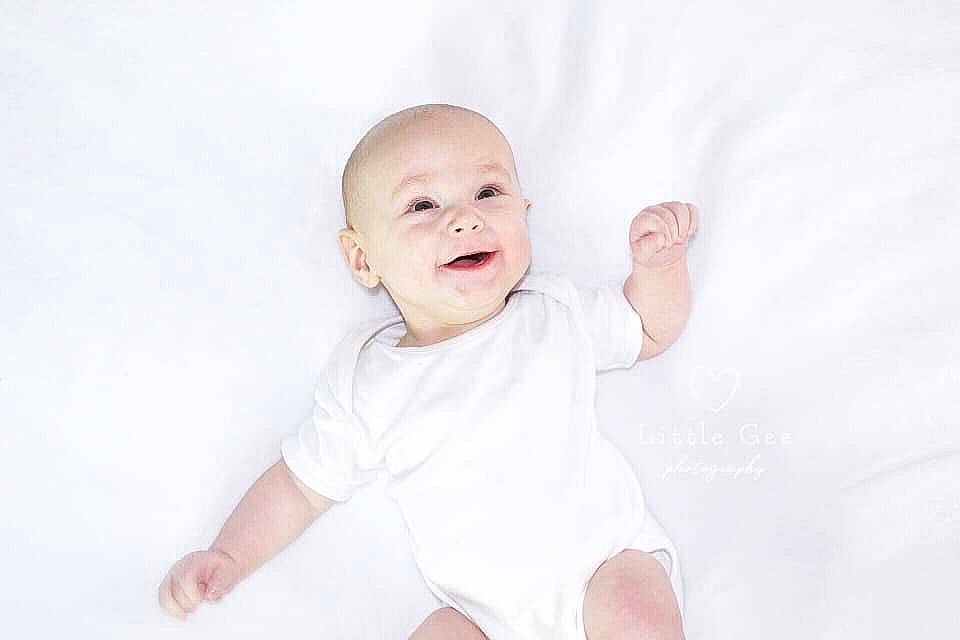 Freddy joined the competition — help win amazing prizes! arm, baby, baby_laughing, baby_products, baby_toddler_clothing, child, facial_expression, gesture, person, photography, portrait, portrait_photography, product, skin, sleeve, smile, toddler, white