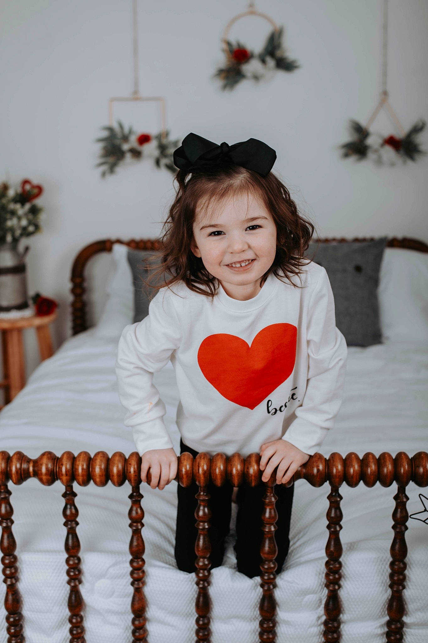 Josephine is registered to the contest to win money with this photo: arm, baby_toddler_clothing, beauty, child, dress, event, fashion_design, happy, houseplant, joy, pattern, people, person, photograph, pink, plant, room, sleeve, smile, textile