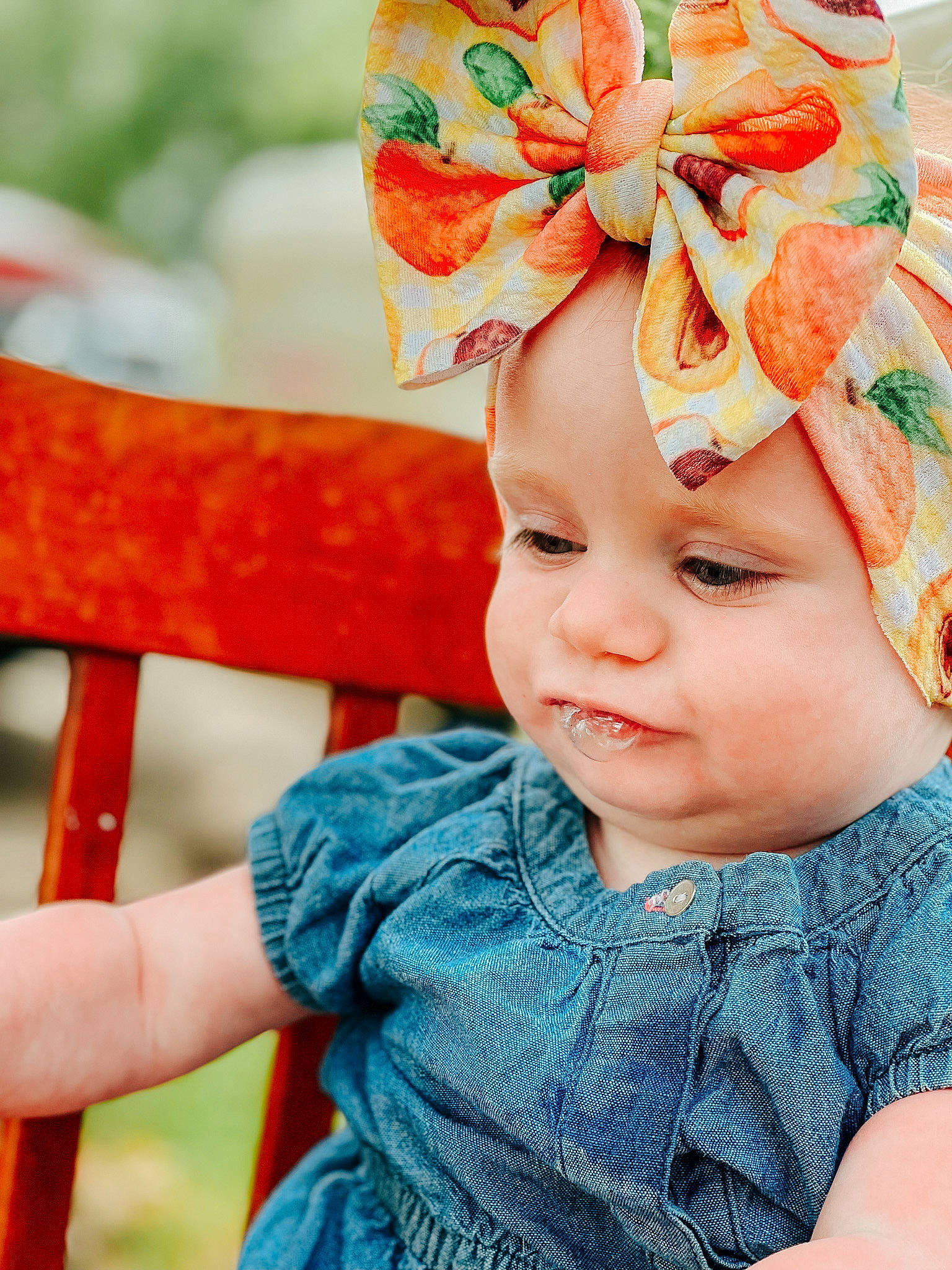 Meredith is registered to the contest to win money with this photo: baby, baby_toddler_clothing, blue, cap, costume_hat, fun, grass, green, happy, hat, headgear, headpiece, headwear, magenta, orange, person, pink, plant, product, summer