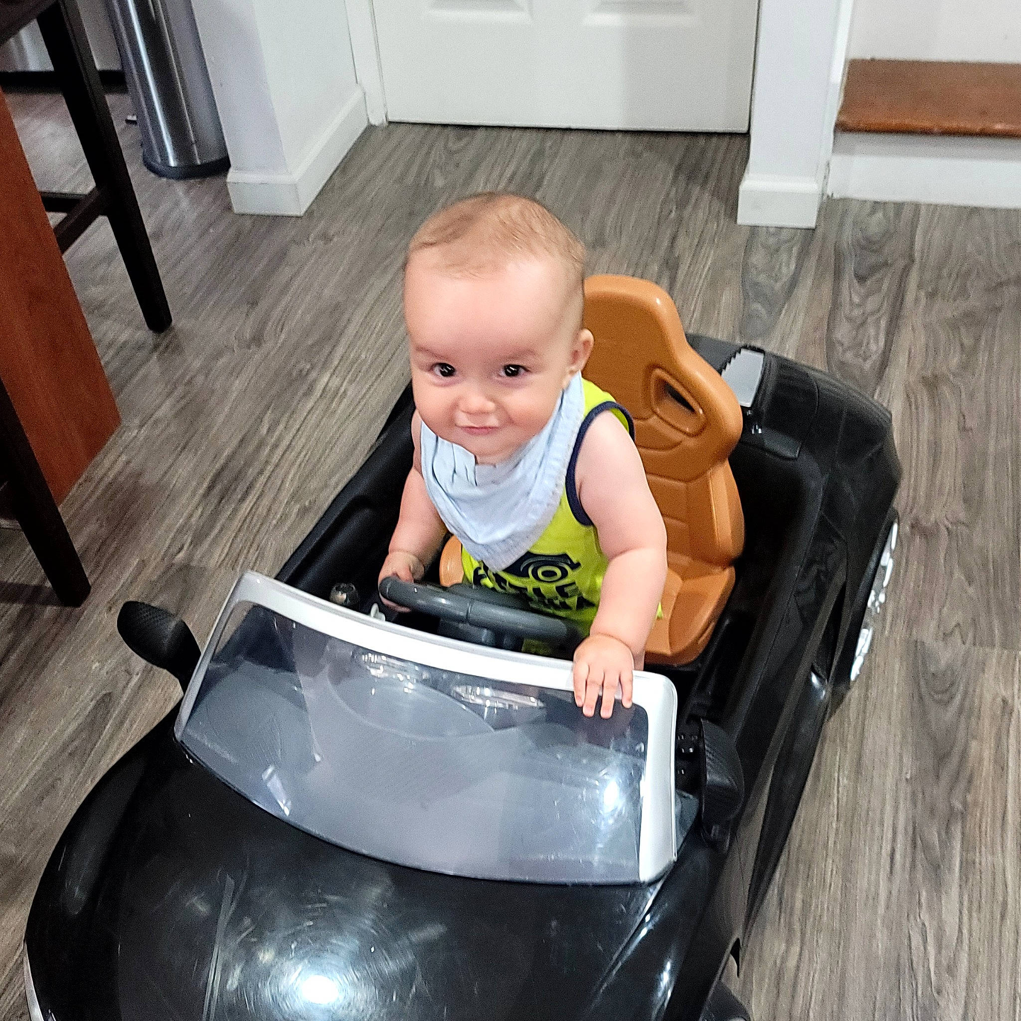 Iker joined the competition — help win amazing prizes! automotive_design, baby, baby_products, baby_toddler_clothing, black, child, cleanliness, comfort, flooring, fun, hardwood, knee, person, photograph, product, sitting, smile, toddler, white, windshield