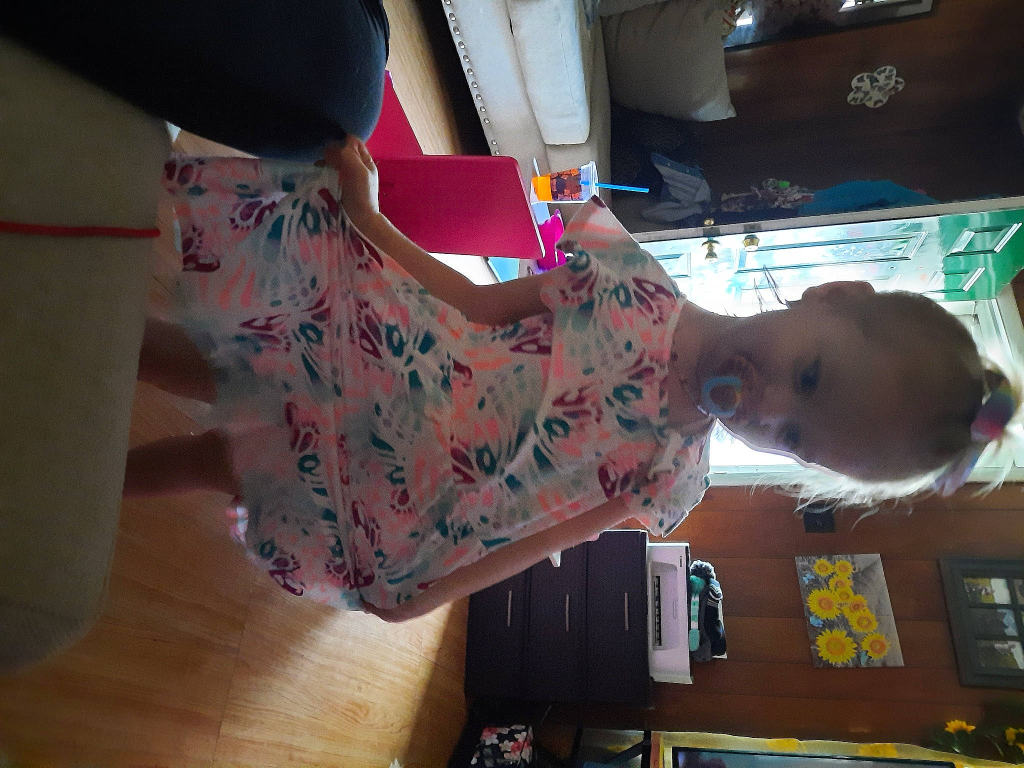 Kinsey joined the competition — help win amazing prizes! baby, baby_toddler_clothing, child, dress, elbow, finger, fun, hardwood, human_leg, magenta, pattern, peach, person, pink, room, sleeve, thigh, toddler, trunk, waist