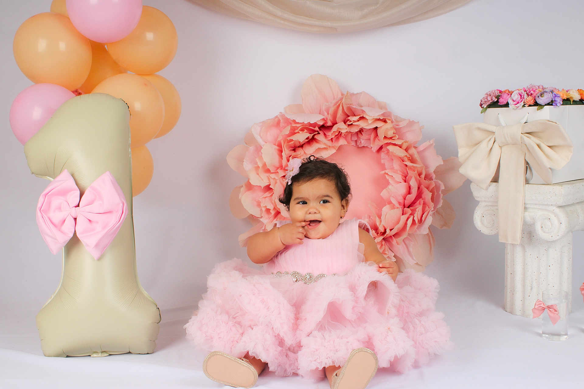 Ayla participe au concours pour gagner de l'argent avec cette photo : baby, child, pink_dress, balloons, flower_backdrop, birthday, celebration, smile, sitting, decorations, ribbon, number_one_balloon, pastel_colors, portrait, cute, happy, indoor, party, headband, shoes