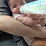 Rylann joined the competition — help win amazing prizes! arms, baby, bottle, child, closeup, clothing, couch, cute, face, feeding, hand, holding, indoor, infant, looking, love, milk, person, skin, tattoo