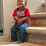 toddler, child, smiling, sitting, stairs, carpet, red_shirt, jeans, indoor, happy, person, face, feet, sock, wall, home, casual, cute, portrait, young