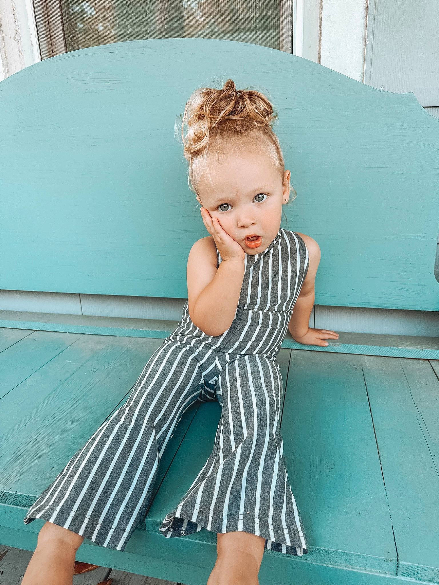 Braylee is registered to the contest to win money with this photo: aqua, azure, baby_toddler_clothing, child, comfort, electric_blue, foot, fun, happy, human_leg, joint, knee, leisure, pattern, person, sitting, sportswear, surprise, thigh, toddler
