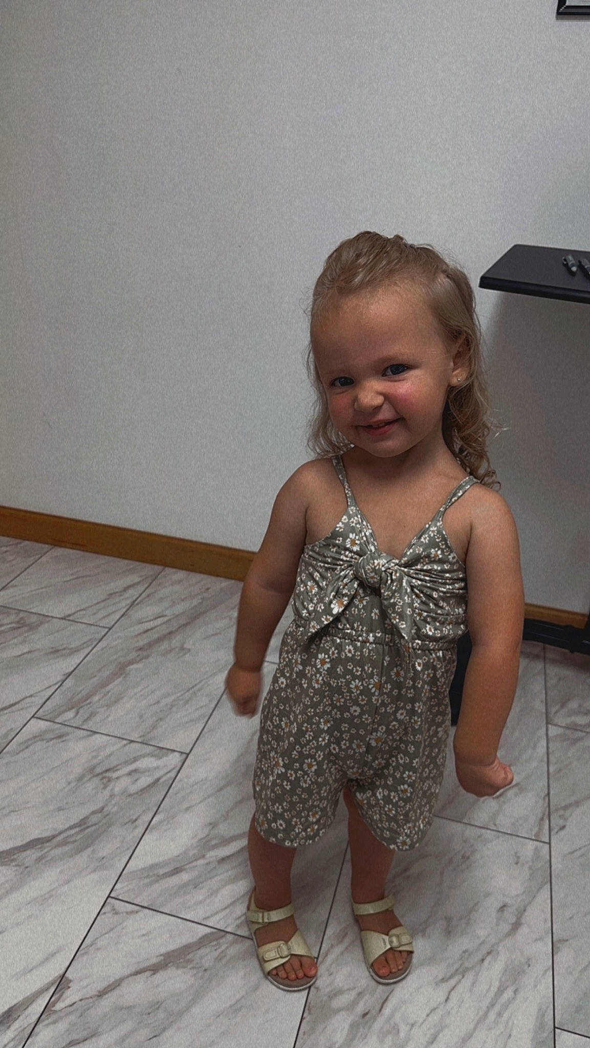Braylee is registered to the contest to win money with this photo: arm, baby_toddler_clothing, child, floor, flooring, foot, fun, hand, happy, hardwood, head, human_leg, joy, leg, person, sandal, skin, smile, thigh, toddler