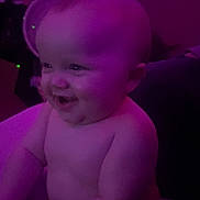 Levi joined the competition — help win amazing prizes! baby, child, infant, purple_light, smiling, sitting, naked, chubby, face, head, arm, body, indoor, person, cute, expression, happy, skin, portrait, human