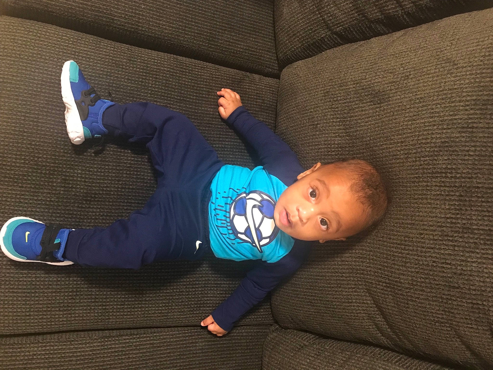 Amir joined the competition — help win amazing prizes! baby, baby_toddler_clothing, child, comfort, couch, denim, elbow, electric_blue, flash_photography, flooring, fun, knee, leg, outdoor_shoe, person, sitting, sleeve, sportswear, toddler, walking_shoe