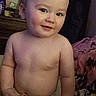 toddler, child, baby, smile, blanket, indoor, face, skin, person, cute, rosy_cheeks, shirtless, bedroom, furniture, cozy, young_child, head, expression, warm, playful