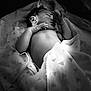 Masai is registered to the contest to win money with this photo: baby, newborn, sleeping, blanket, black_and_white, infant, soft, peaceful, hand, wrapped, delicate, portrait, cute, resting, child, skin, face, cozy, toddler, monochrome