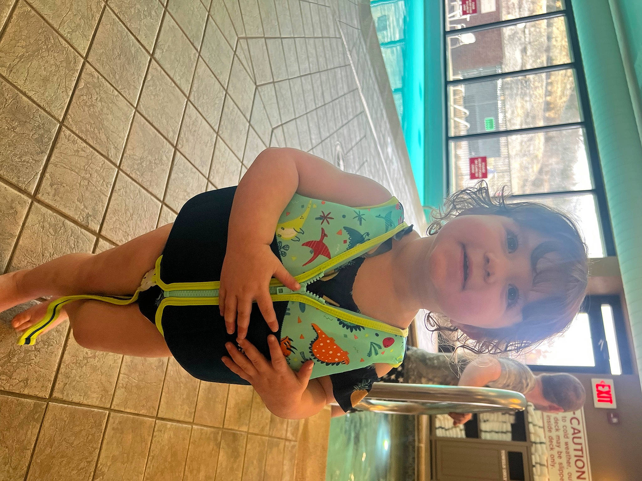 Danica is registered to the contest to win money with this photo: abdomen, barefoot, chest, eyewear, flooring, foot, fun, human_leg, knee, leisure, pattern, person, sandal, smile, sportswear, thigh, trunk, waist