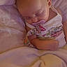 Penelope joined the competition — help win amazing prizes! baby, bed, bedding, blanket, child, closed_eyes, clothing, cozy, face, head, indoors, infant, onesie, pacifier, peaceful, pink_blanket, portrait, resting, sitting, sleeping