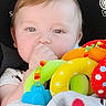Declan is registered to the contest to win money with this photo: baby, child, blond_hair, thumb_sucking, plush_toy, colorful_toy, blanket, mickey_mouse, car_seat, infant, cute, portrait, soft_light, comfort, indoors, young_child, face, clothing, person, sitting