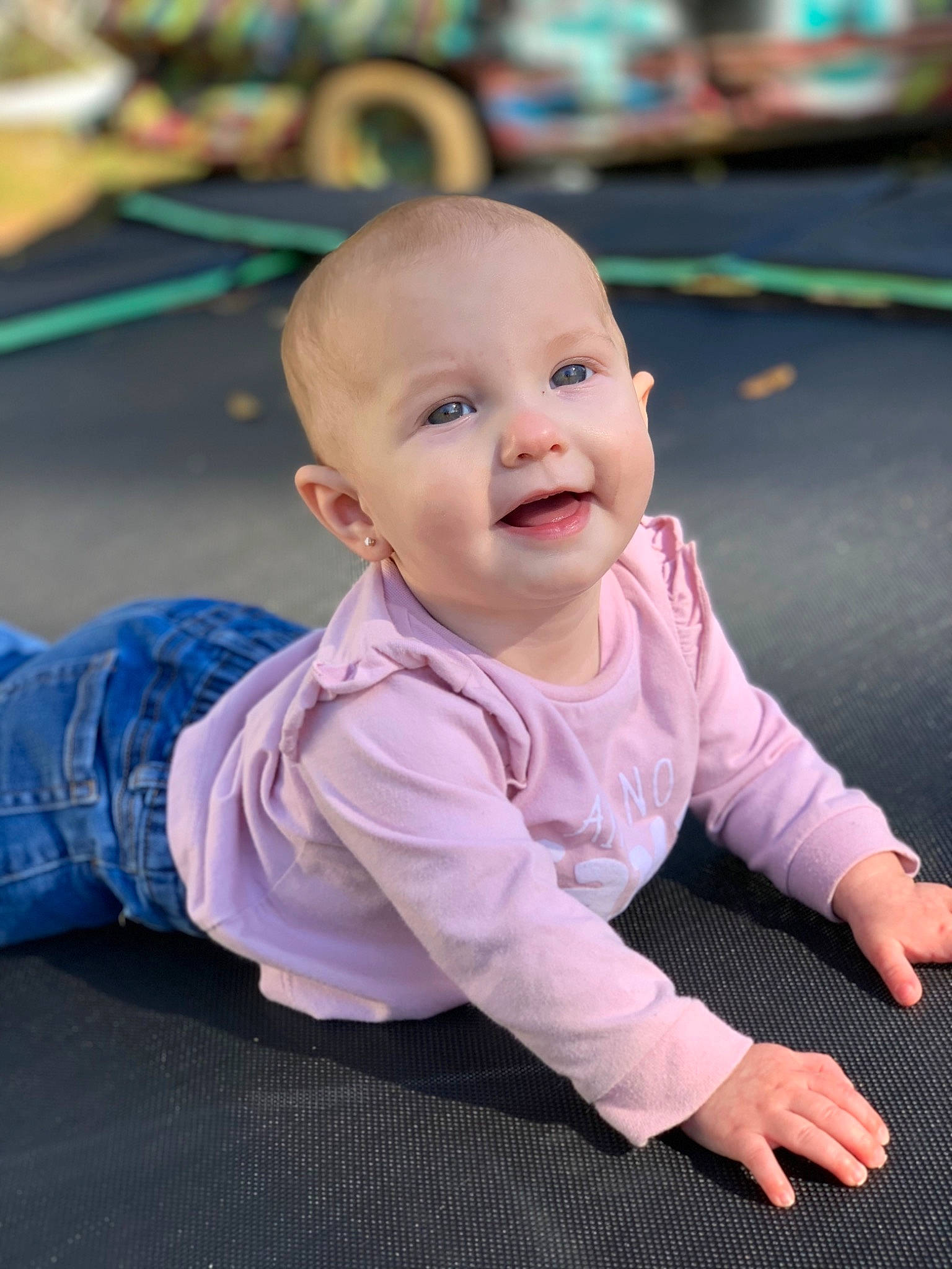 Ashton is registered to the contest to win money with this photo: ankle, baby, baby_crawling, baby_toddler_clothing, cheek, child, crawling, denim, ear, facial_expression, finger, floor, joint, laugh, mouth, person, play, sitting, skin, toddler