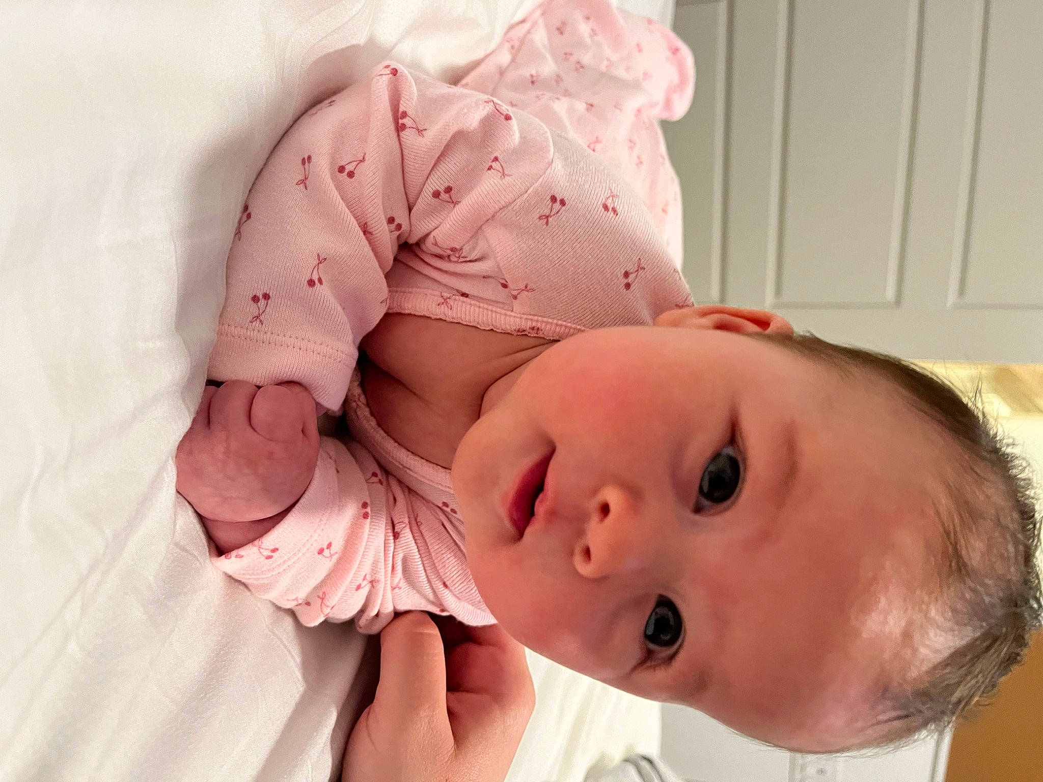 Maddie is registered to the contest to win money with this photo: baby, baby_toddler_clothing, cheek, chin, comfort, eye, eyelash, face, finger, gesture, head, headgear, lip, mammal, mouth, neck, nose, person, skin, sleeve