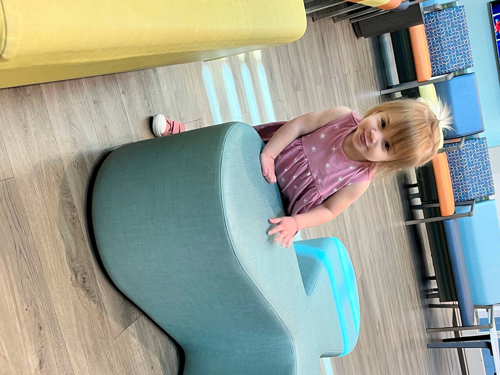 Royal is registered to the contest to win money with this photo: auto_part, automotive_design, automotive_exterior, car_seat, child, comfort, electric_blue, fun, human_leg, joy, knee, leisure, magenta, person, recreation, sitting, smile, thigh, travel, vacation