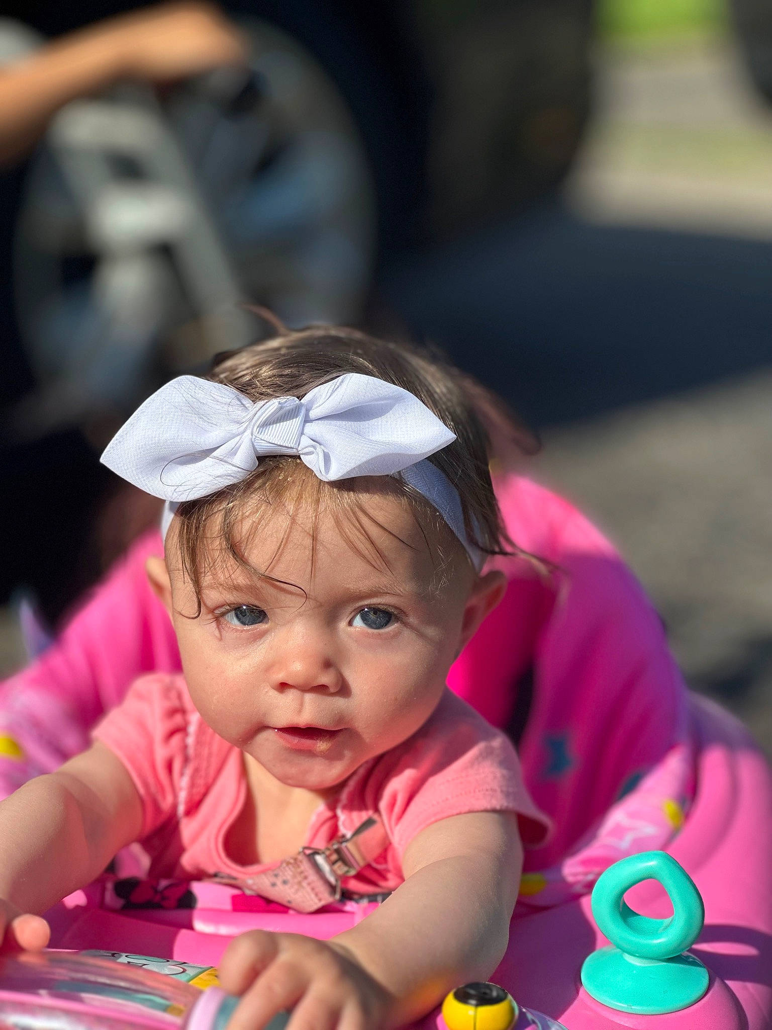 Brinley is registered to the contest to win money with this photo: baby, baby_toddler_clothing, child, event, face, fashion_accessory, fun, grass, hairstyle, happy, headwear, leisure, magenta, party, person, pink, recreation, sitting, skin, toddler