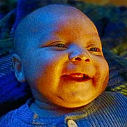 Zy'Iir joined the competition — help win amazing prizes! baby, smile, face, tongue, blue_clothing, blanket, texture, happy, infant, closeup, portrait, child, cute, warm_light, cool_light, indoors, expression, skin, head, young