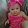 Zelpa joined the competition — help win amazing prizes! baby, child, infant, pink_bow, headband, pink_dress, orange_dress, sitting, couch, soft_surface, curious, face, skin, hand, legs, indoors, portrait, cute, young_child, person