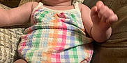 Lakelynn joined the competition — help win amazing prizes! baby, smiling, infant, colorful_clothing, couch, cushion, happy, face, child, indoors, patterned_fabric, cheerful, skin, person, seated, plaid, closeup, cute, young, bright