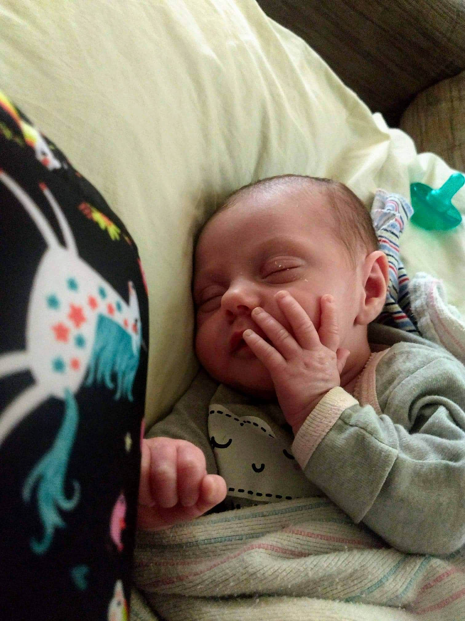Evalynn is registered to the contest to win money with this photo: arm, baby, baby_sleeping, baby_toddler_clothing, cheek, child, chin, comfort, finger, gesture, happy, head, linens, mouth, nose, person, skin, sleeve, smile, thumb