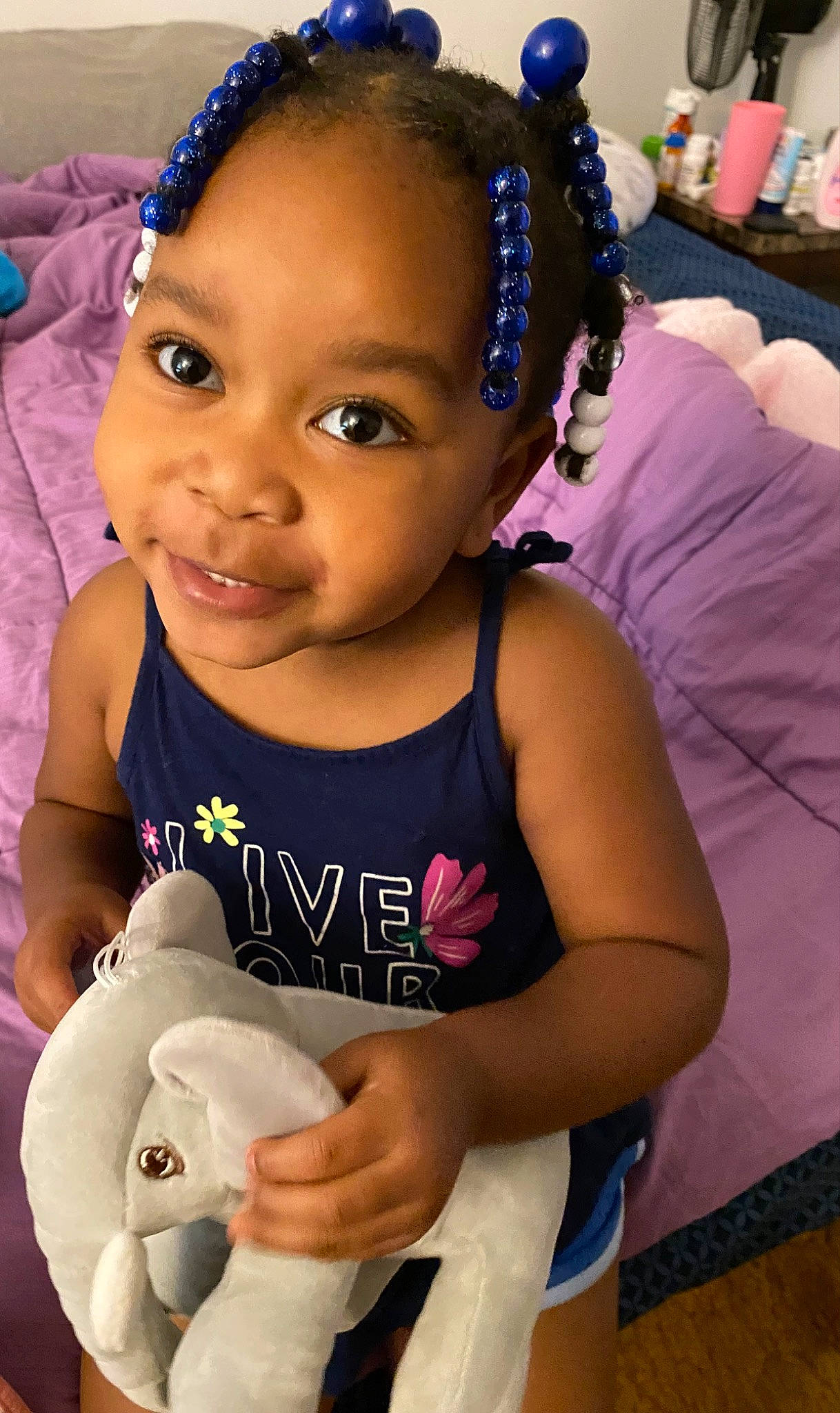 Cali joined the competition — help win amazing prizes! baby, baby_toddler_clothing, black_hair, cheek, child, event, fun, happy, jewellery, lip, organ, person, pink, purple, skin, smile, stuffed_toy, t_shirt, toddler, toy
