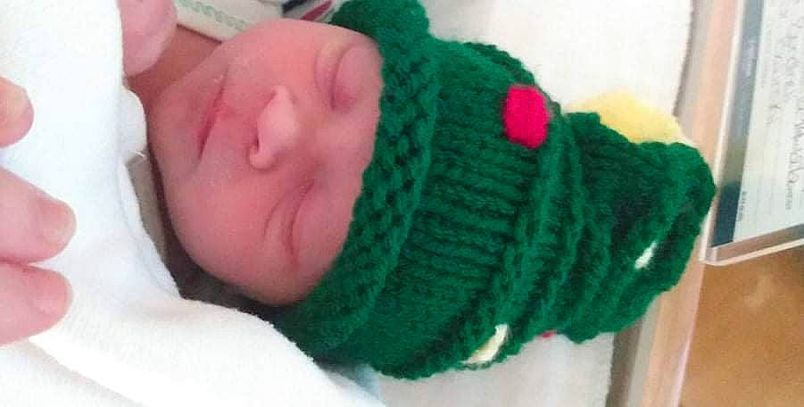 Chloey joined the competition — help win amazing prizes! art, baby, baby_sleeping, baby_toddler_clothing, comfort, craft, creative_arts, fashion_accessory, green, headwear, knit_cap, magenta, pattern, person, sleeve, textile, thread, thumb, toddler, wool