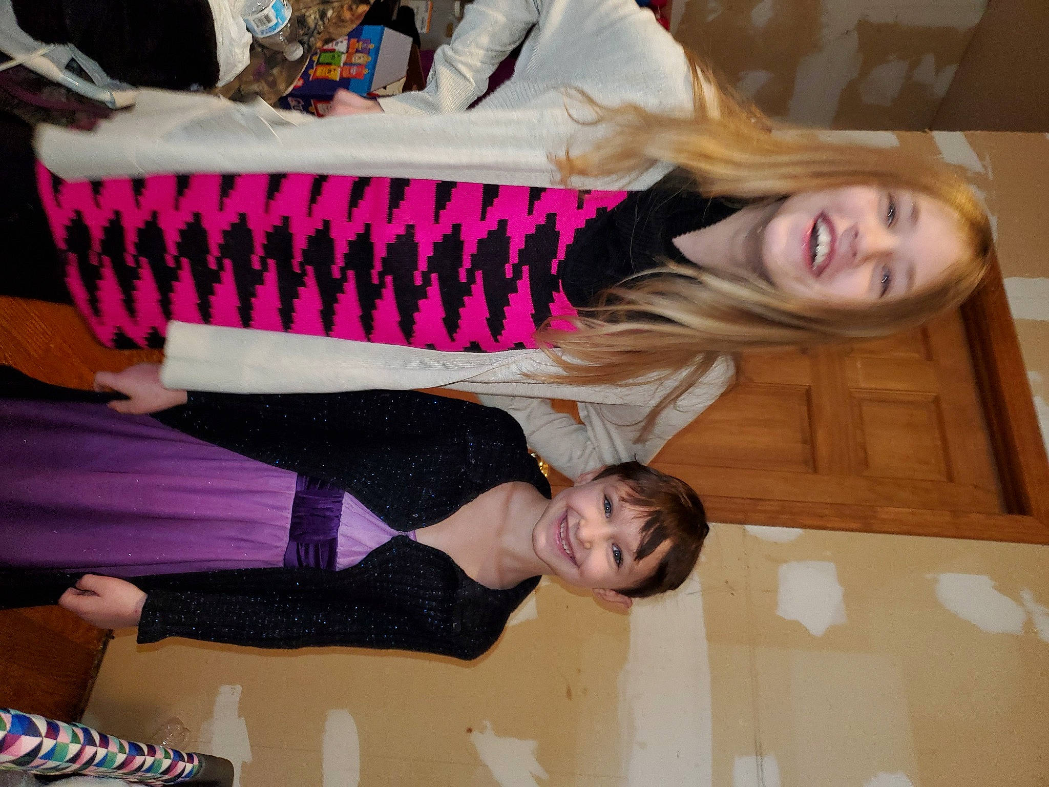 Nevaeh is registered to the contest to win money with this photo: arm, child, comfort, event, face, facial_expression, flooring, fun, happy, hardwood, human_leg, joint, joy, knee, leisure, pattern, person, room, smile, thigh