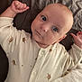 Elio participe au concours pour gagner de l'argent avec cette photo : baby, infant, onesie, turtle_pattern, blue_eyes, lying_down, blanket, bed, cute, child, skin, face, expression, small_hands, sleepwear, indoors, portrait, young, cozy, resting